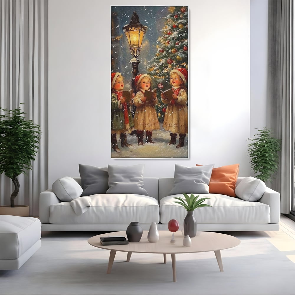 Tablou canvas cu pictura cu trei fetite colindatoare, in rama de aluminiu argintiu, pe perete intr-un living
